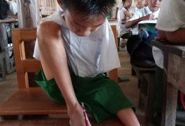 Without arms, a boy embraces the future